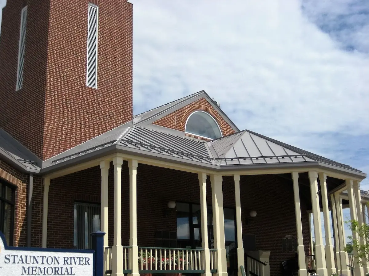 Skilled roofing craftsmen working on a residential roof in Courtland